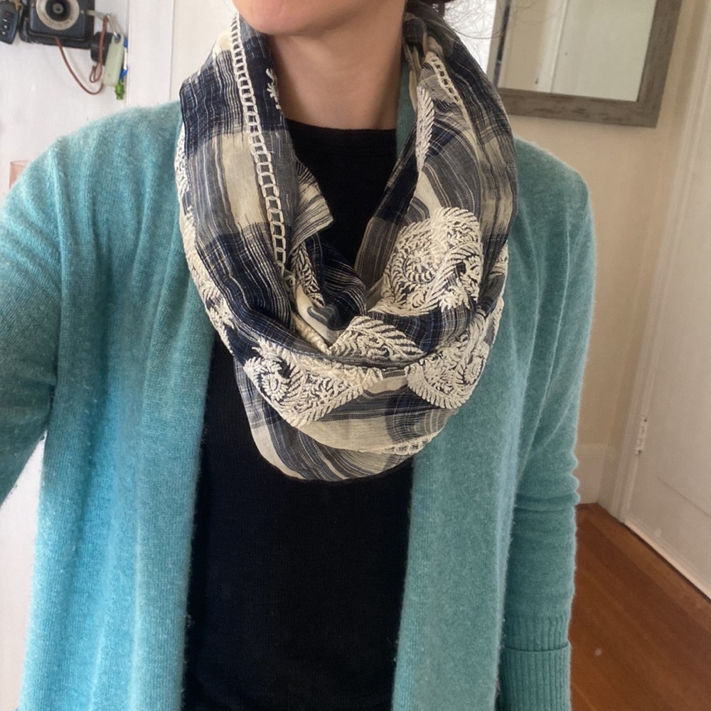 Delicate blue and white infinity scarf with textured embroidery